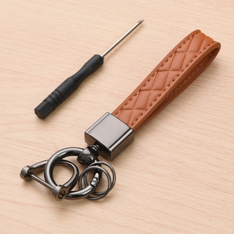 Metal car keyring with lanyard loop – brown version shown with screwdriver tool