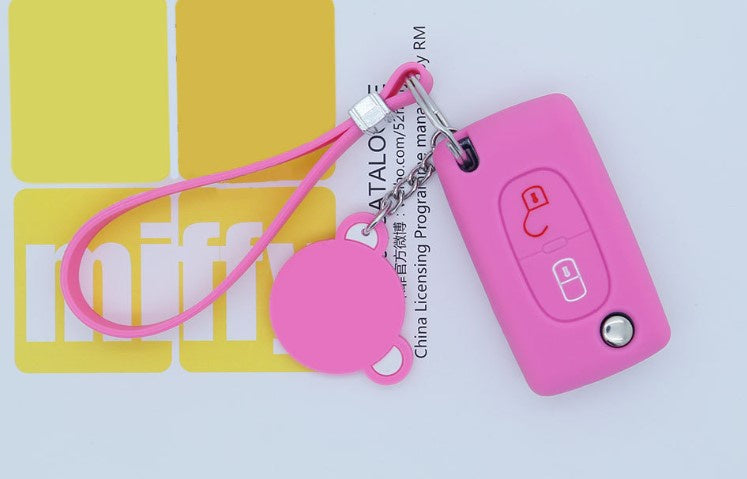 Key fob cover for Peugeot 2-button folding keys – silicone – pink cover with wrist strap and tag