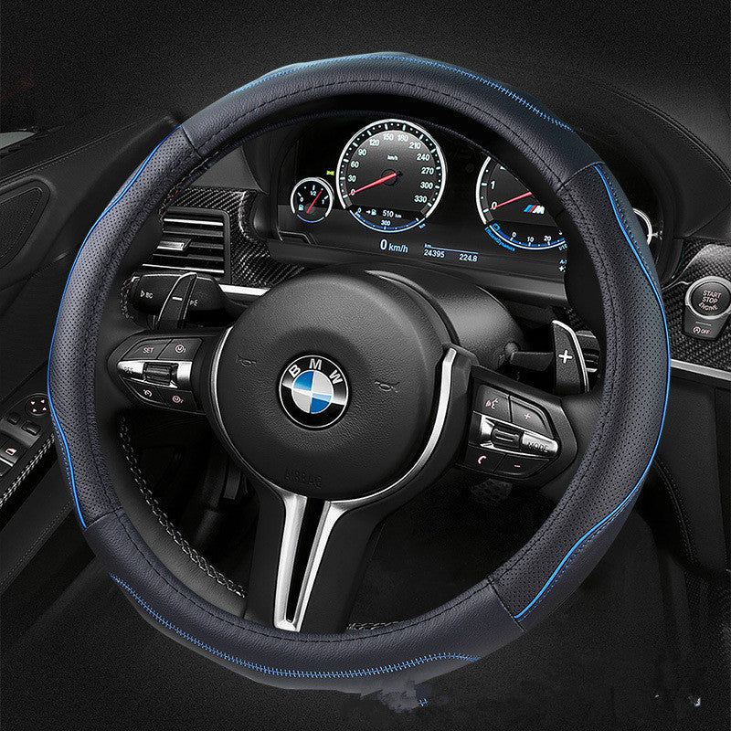 Soft-grip steering wheel cover, 36cm or 38cm – black cover with blue stitching on a BMW steering wheel