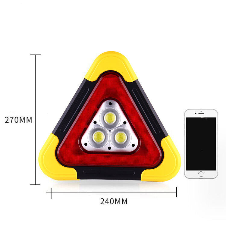 Folding tripod car warning triangle – size comparison next to a smartphone