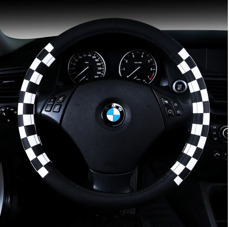 Chequered leather-look steering wheel cover, 38cm – fitted on a BMW steering wheel, black and white chequered pattern view
