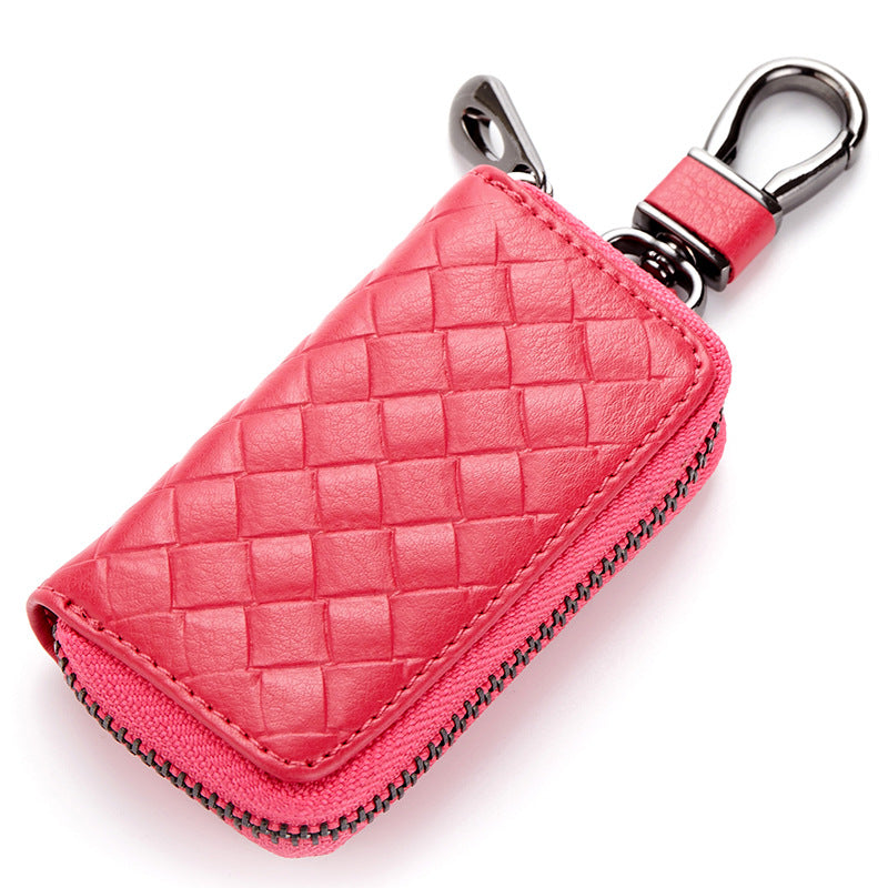 Woven leather car key holder – pink version with metal clasp on white background