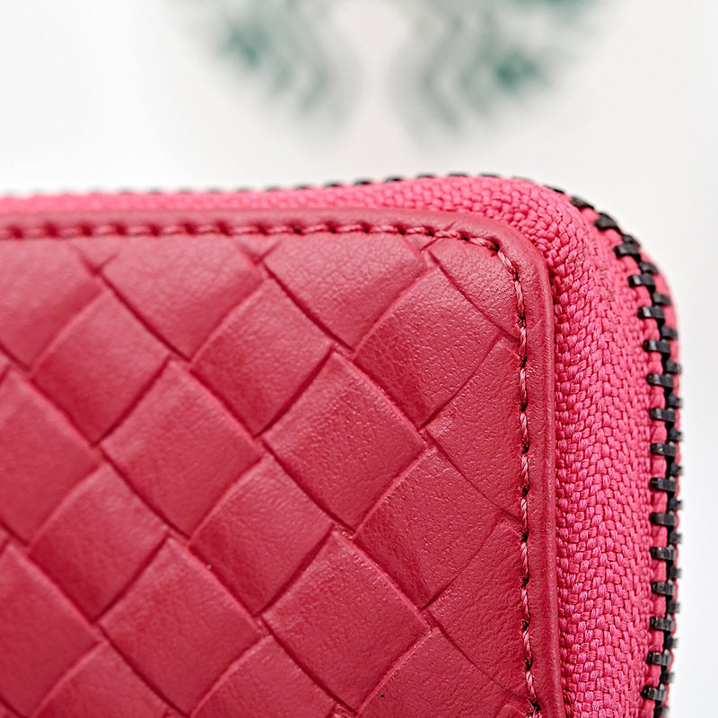 Woven leather car key holder – close-up of pink woven leather texture and zip