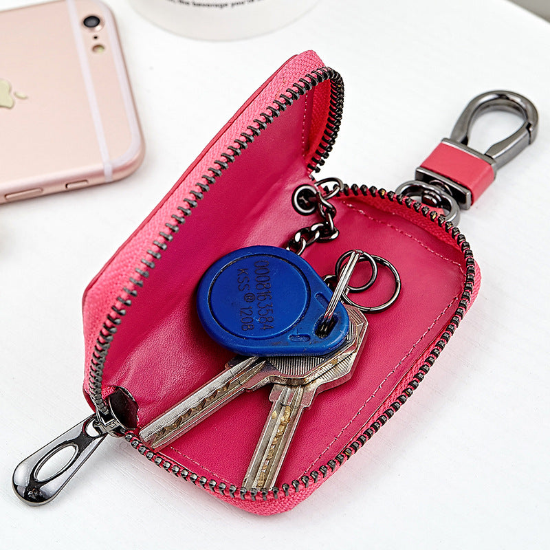 Woven leather car key holder – pink version open showing keys inside