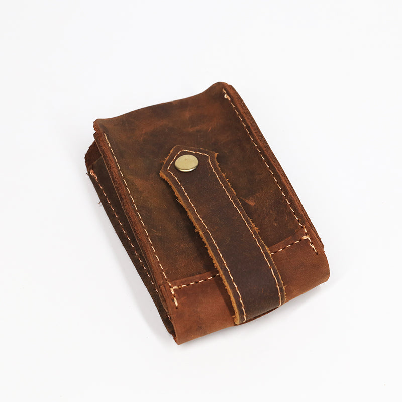Vintage leather car key pouch – brown – closed pouch with strap, angled front view