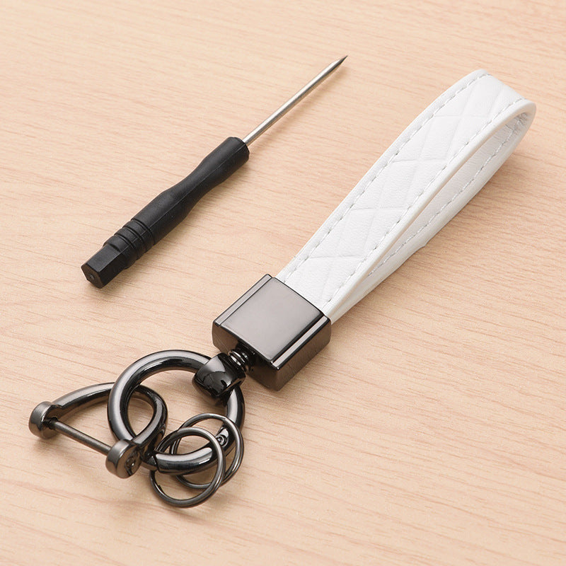 Metal car keyring with lanyard loop – white version shown with screwdriver tool