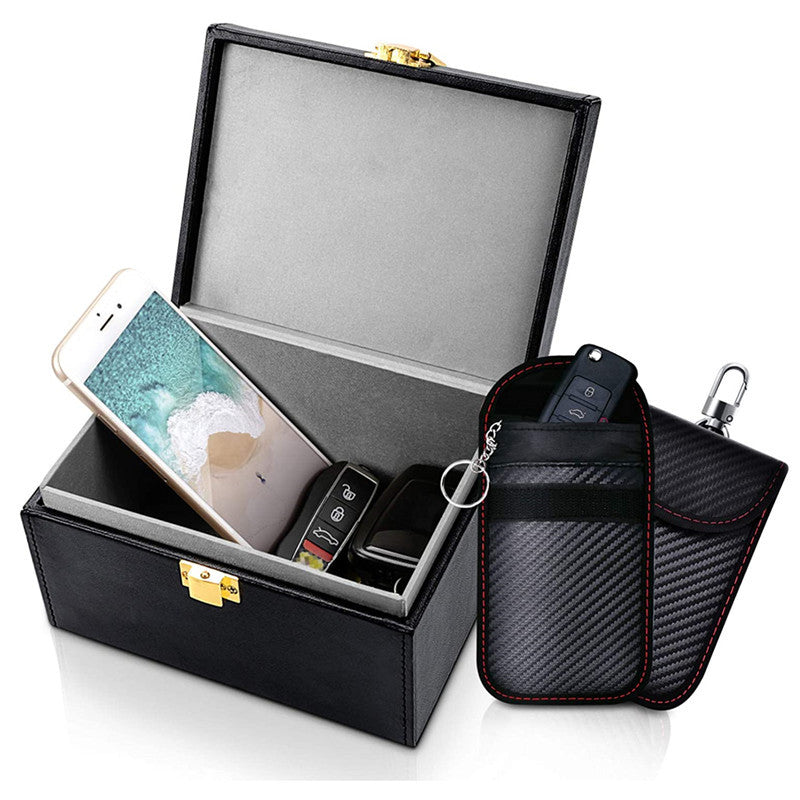 Faraday key box with 2 signal-blocking key pouches – open box with phone and key pouches beside it