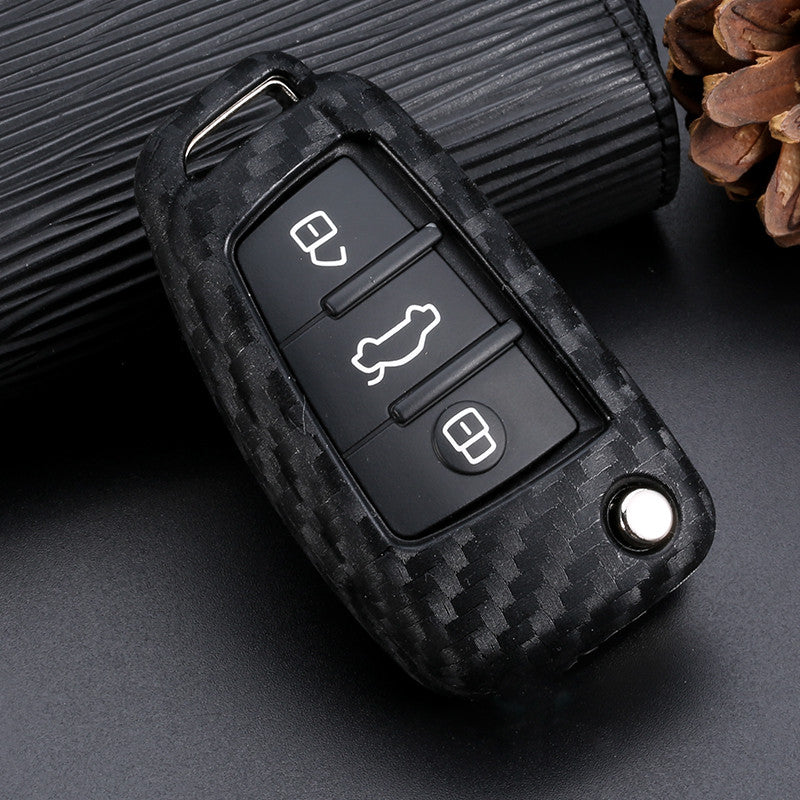 Key fob cover for Audi keys – carbon-look silicone – close-up front view on a display stand