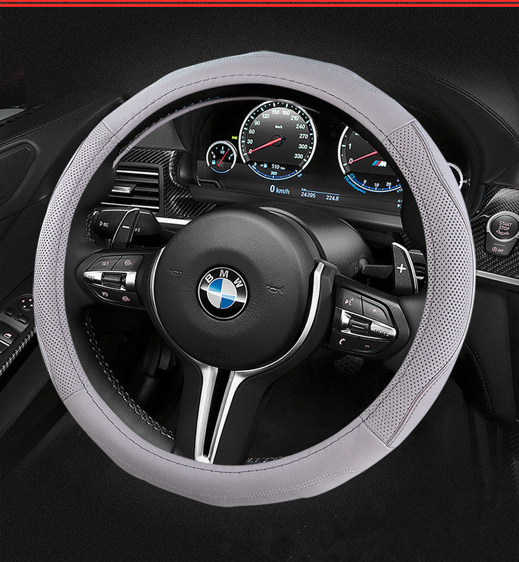 Soft-grip steering wheel cover, 36cm or 38cm – grey perforated cover on a BMW steering wheel