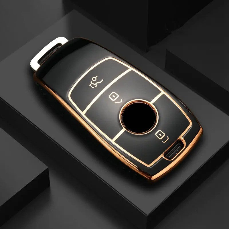 Key fob cover for Mercedes-Benz smart keys – TPU – black and gold cover on dark geometric display