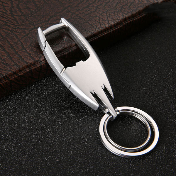 Stainless steel car key ring – close-up of silver keyring on leather