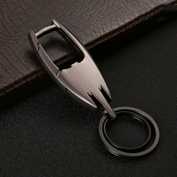 Stainless steel car key ring – close-up of gunmetal keyring on leather