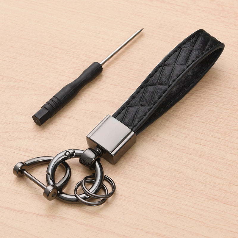 Metal car keyring with lanyard loop – black version shown with screwdriver tool