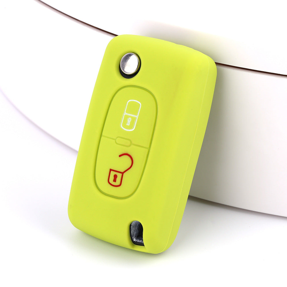 Key fob cover for Peugeot 2-button folding keys – silicone – lime green silicone cover on white surface