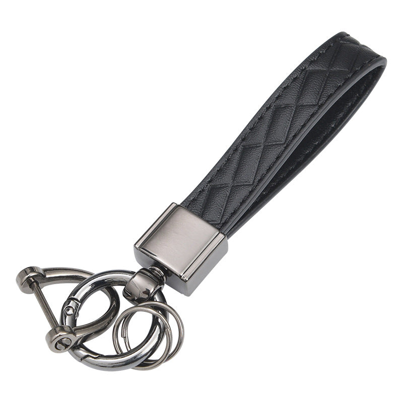 Metal car keyring with lanyard loop – close-up of black leather loop and clasp