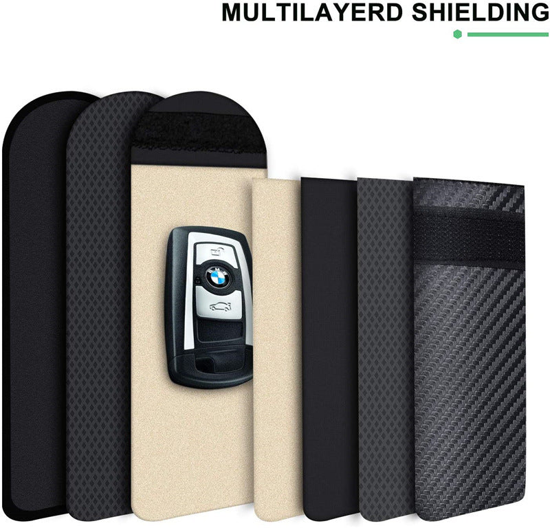Faraday pouch for car keys – keyless entry signal blocker – layers of shielding material laid out beside car key fob