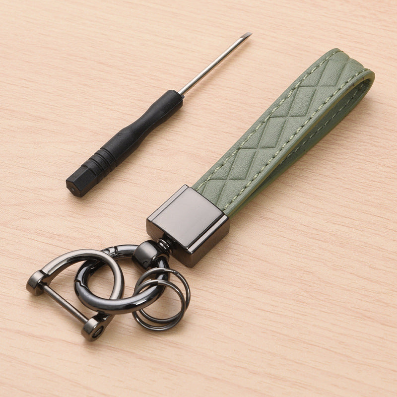 Metal car keyring with lanyard loop – green version shown with screwdriver tool